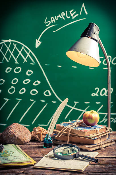 istock Examination of samples coal and oil at a geography lesson 486684494