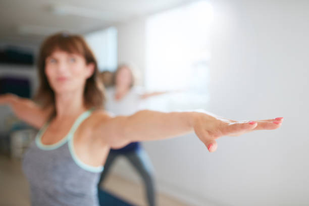 istock Woman working out in yoga class 486689380