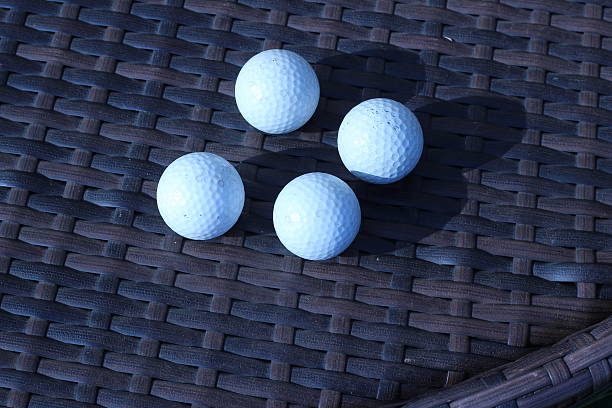istock Golf ball on a brown background that intertwine 486689512