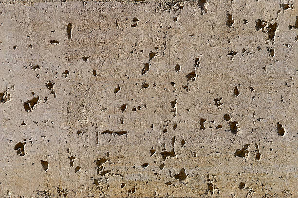 istock Grunge concrete wall covered with old paint, dust and stains 486689855
