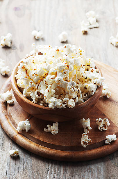 istock Salt popcorn on the wooden table 486690860