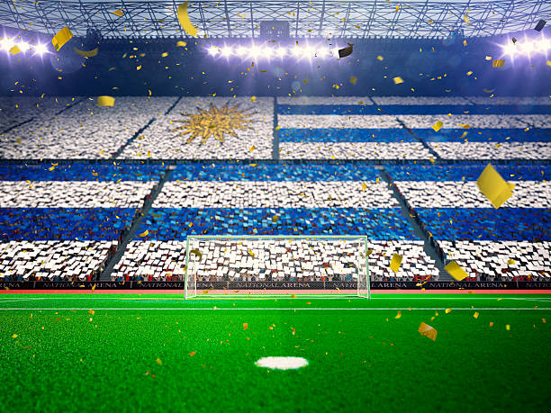 Flag Uruguay  of fans. Evening stadium arena Blue Flag Uruguay  of fans.Evening stadium arena soccer field championship win. Confetti and tinsel Blue Toning uruguay photos stock pictures, royalty-free photos & images