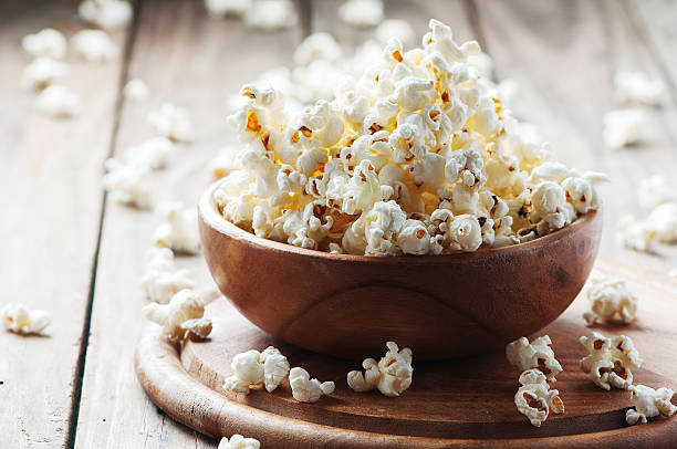 istock Salt popcorn on the wooden table 486691206