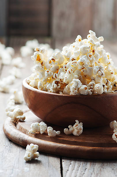 istock Salt popcorn on the wooden table 486691428