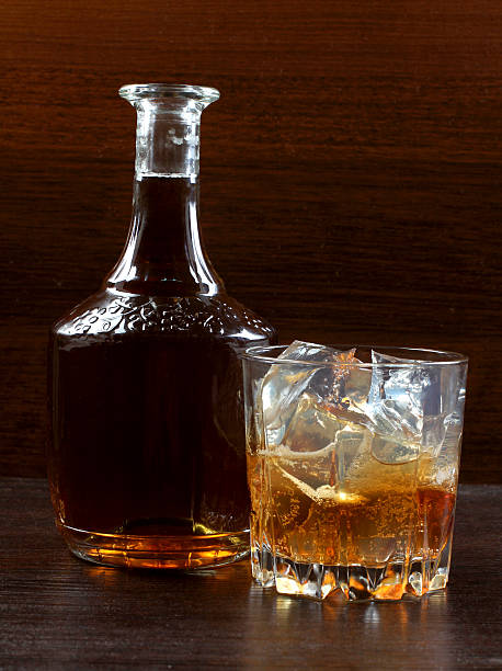 istock Whiskey glass on wood 486691921