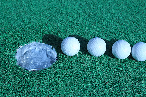 istock Wood and golf balls on the green grass 486692496