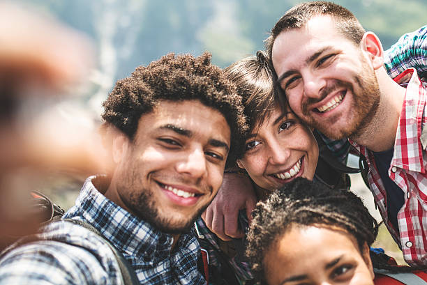 istock group of friends doing a selfie 486694569