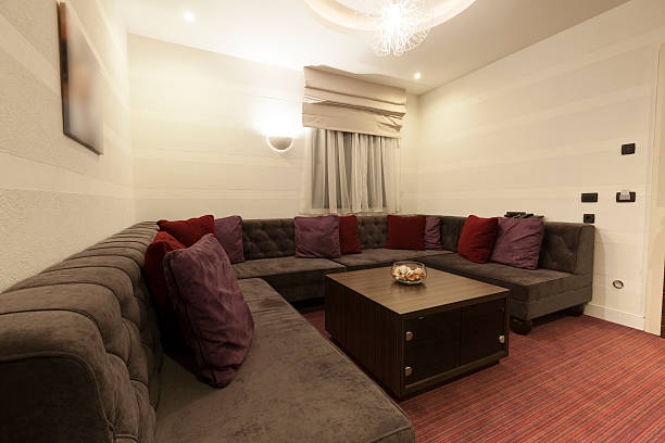 istock Big corner sofa in luxury hotel room 486695349