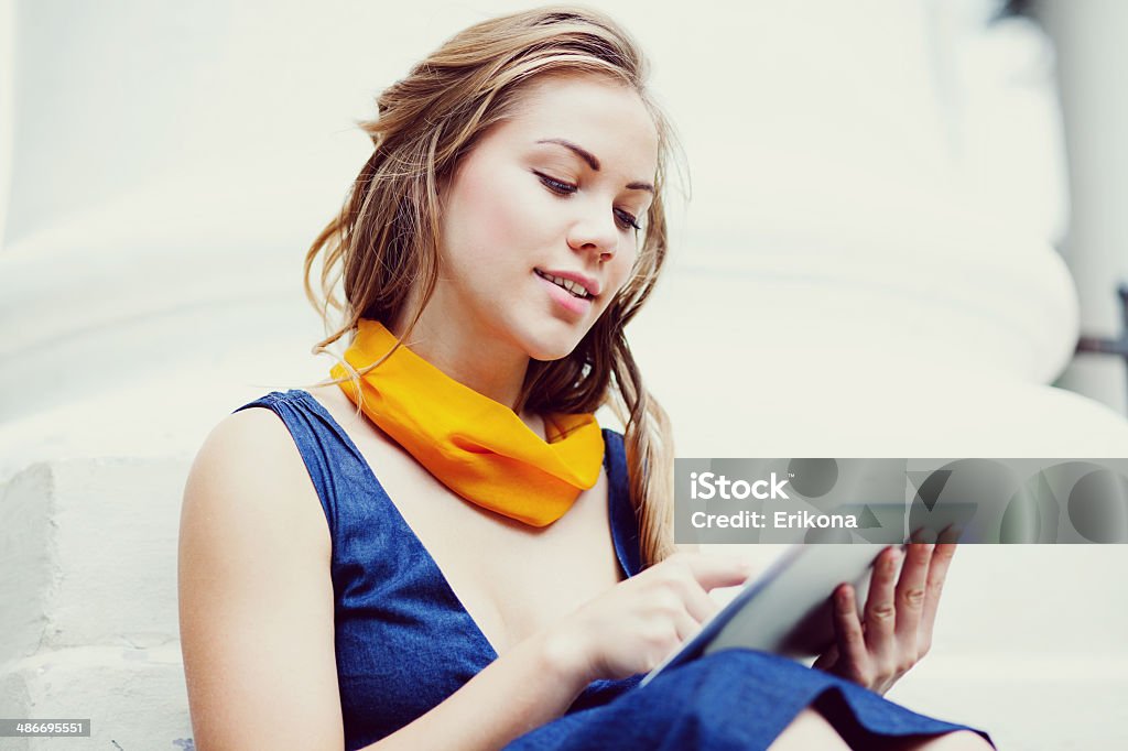 Woman touching screen digital tablet Woman touching screen digital tablet on outdoors Adult Stock Photo