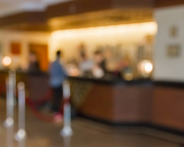 istock Customers and receptionist at counter in blur motion 486695726
