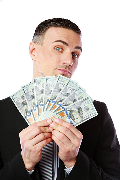 istock Handsome businessman holding US dollars 486695881