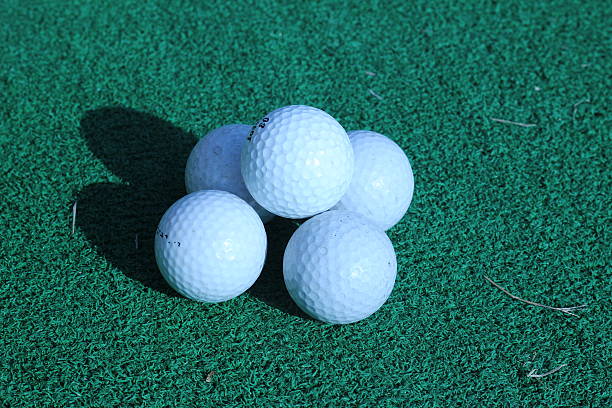 istock Wood and golf balls on the green grass 486696556