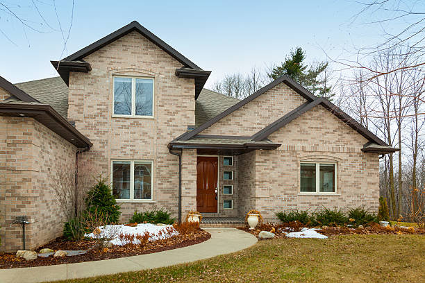 istock Brick Home in Spring With Last Snow Melting 486696915
