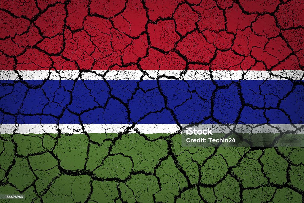 Gambia Flag Gambia Flag painted on cracked ground Abstract Stock Photo