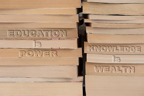 istock education is power knowledge is wealth, sentence on the books heap 486696972