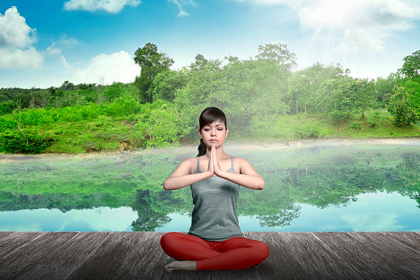 istock Woman Doing Yoga At The Lake 486697800