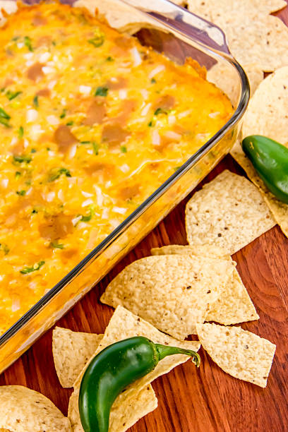 istock bean dip with jalapenos, sour cream and cheddar cheese 486698628