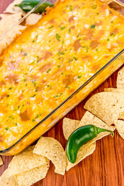 istock bean dip with jalapenos, sour cream and cheddar cheese 486699400