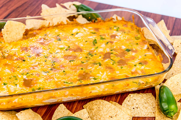istock bean dip with jalapenos, sour cream and cheddar cheese 486699492
