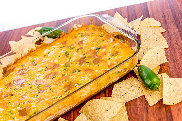 istock bean dip with jalapenos, sour cream and cheddar cheese 486699600