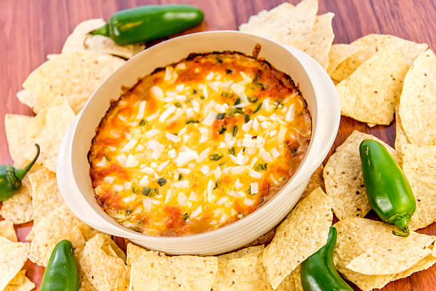 istock bean dip with jalapenos, sour cream and cheddar cheese 486700144
