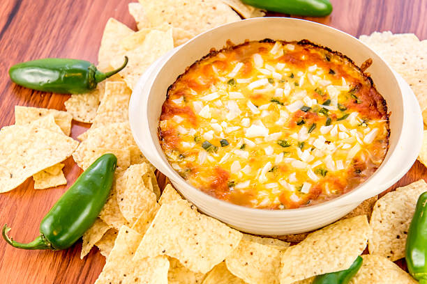 istock bean dip with jalapenos, sour cream and cheddar cheese 486700252