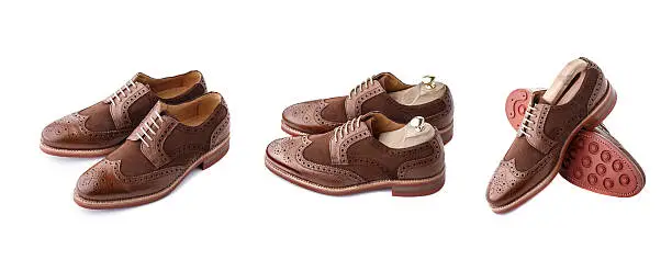 Set of two tone brown suede brogues (also known as derbies,gibsons or wingtips) on thick welted red rubber sole.