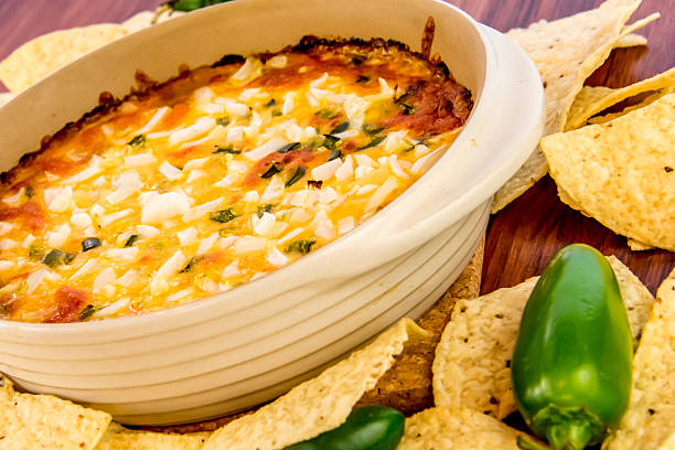 istock bean dip with jalapenos, sour cream and cheddar cheese 486700982