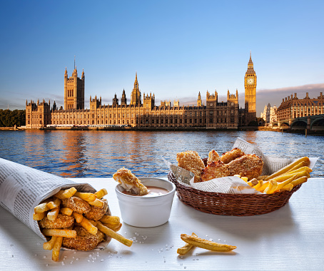 Traditional food Fish and Chips against Big Ben in London, England