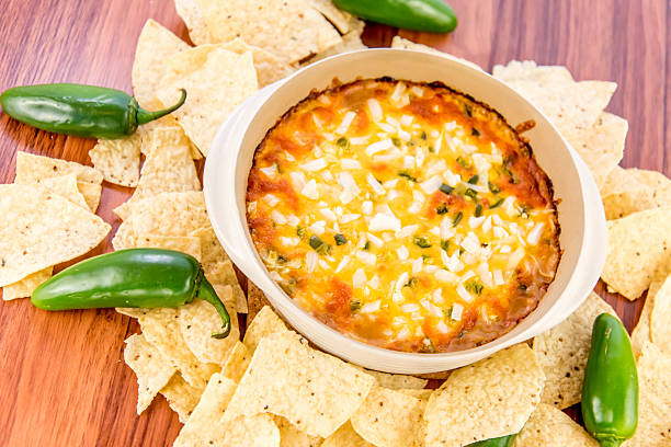 istock bean dip with jalapenos, sour cream and cheddar cheese 486701350