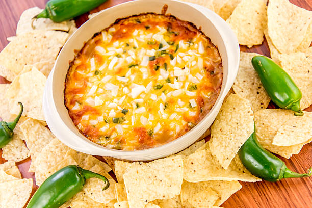 istock bean dip with jalapenos, sour cream and cheddar cheese 486701606