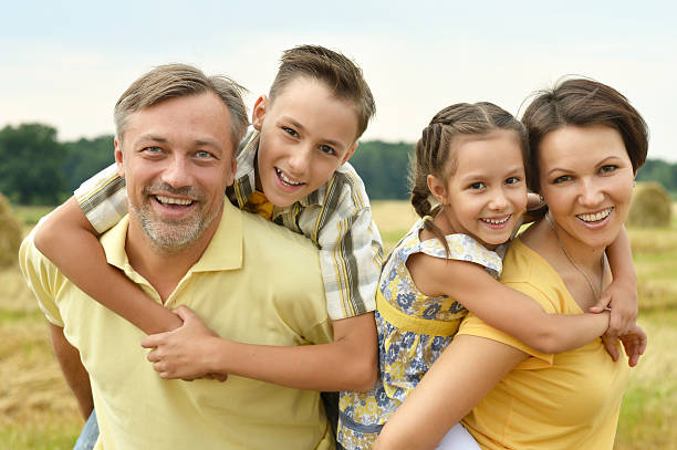 istock Happy family in wheat field 486703500