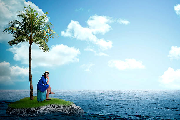 istock Asian tourist sit on the suitcase on the small island 486704484