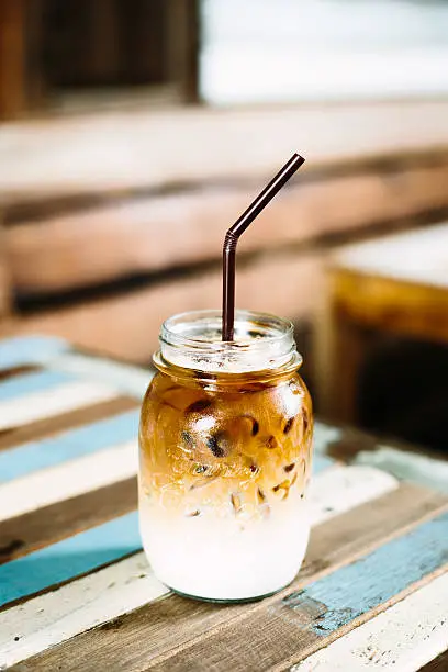 Photo of Iced Coffee Glass On The Table Wood