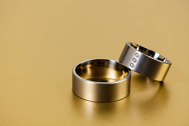 istock Wedding Rings on Golden Background 486706598