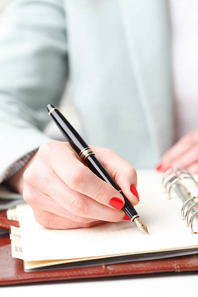 istock Businesswoman writing 486709485