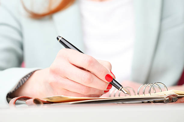 istock Businesswoman writing 486709499