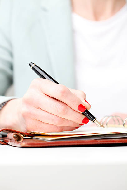 istock Businesswoman writing 486709513