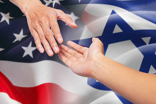 istock Helping hands with israel and american flags 486709960