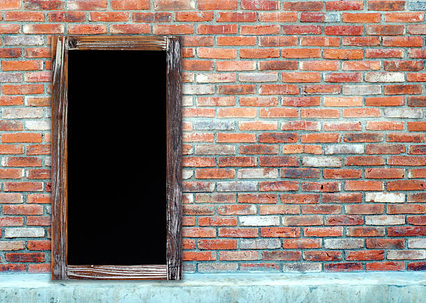 istock Blank vintage chalk board on brick wall 486712142