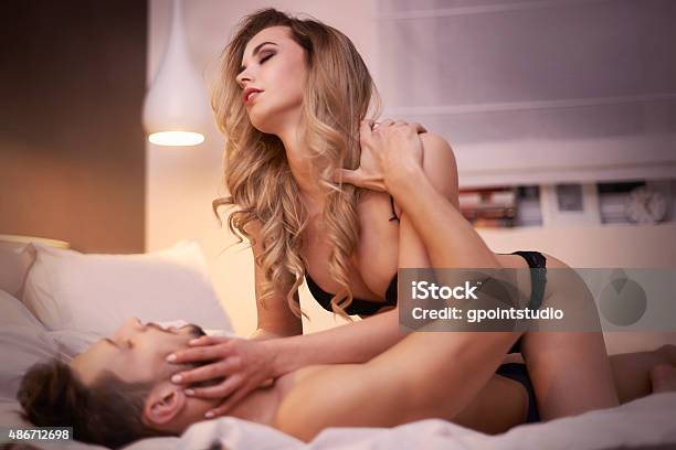 Passionate Lovers In Their Bedroom Stock Photo - Download Image Now - Sexual Issues, Sex and Reproduction, Couple - Relationship