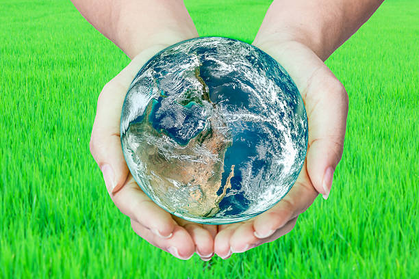 istock Woman holding globe on her hands 486713026