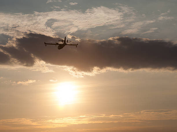 istock Silhouette of an airplane at sunset. 486714798