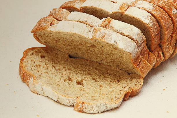 istock Fresh sliced bread on white fabric taken closeup. 486717790