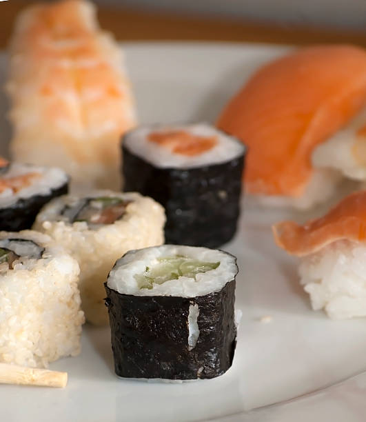 istock Different japanase sushi rolls with chopstic 486718948