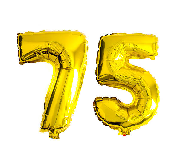 istock Number 75 written with golden foil helium balloons 486720190
