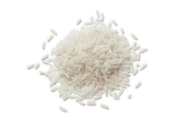 Heap of raw Jasmine rice stock photo