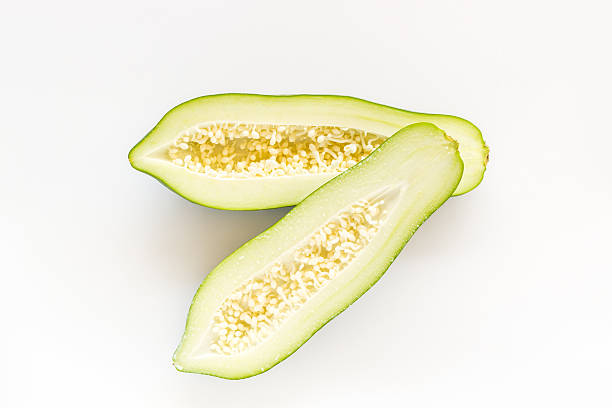 istock Half cut of green papaya. 486721186