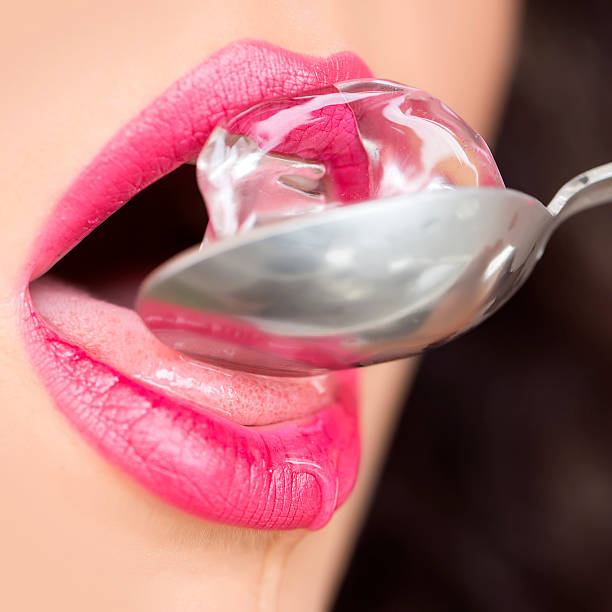 femme bouche avec ice cube - spoon tasting women sex symbol photos et images de collection