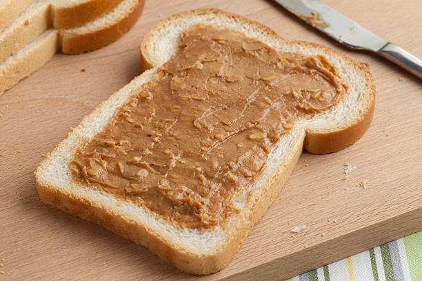 istock Slice of bread with peanut butter 486723832